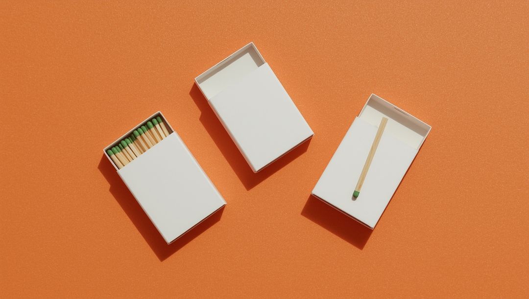 Minimalist Matchbox Trio on Vibrant Orange Background