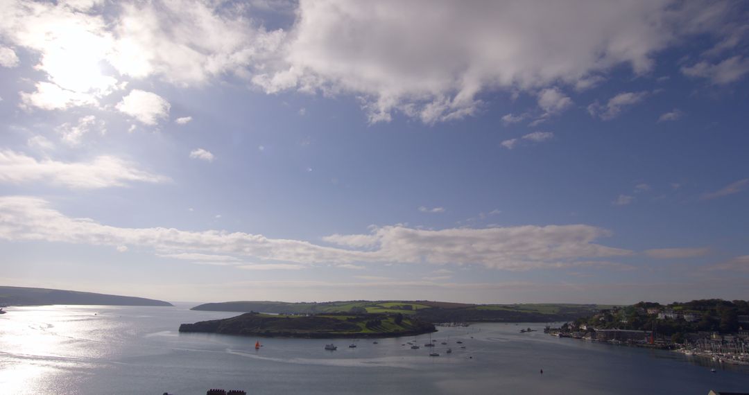 Tranquil Seascape with Cloudy Sky and Lush Countryside Horizon - Free Images, Stock Photos and Pictures on Pikwizard.com