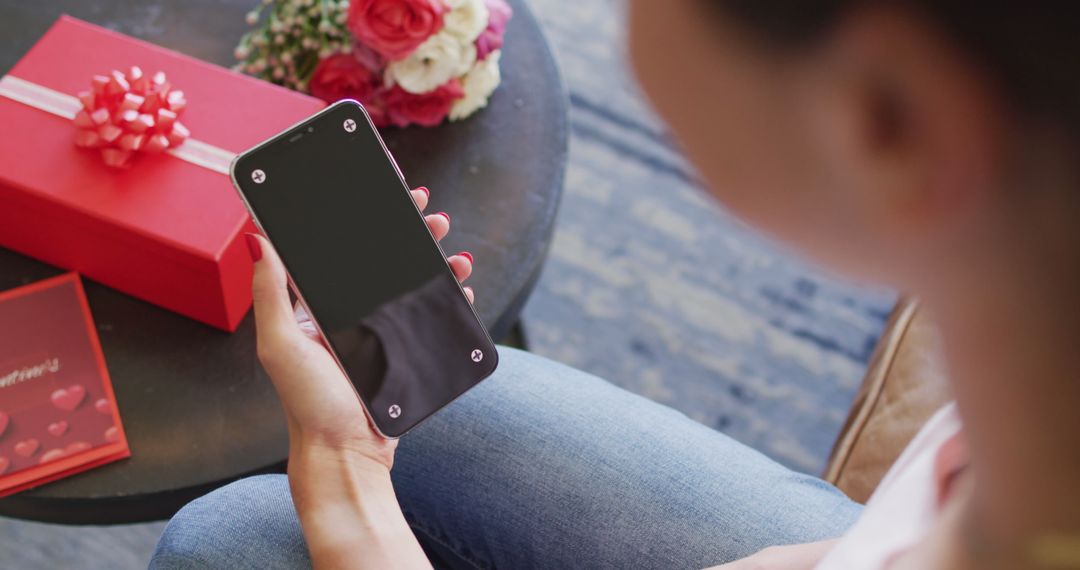 Woman Using Smartphone for Valentine's Day Video Call Celebration