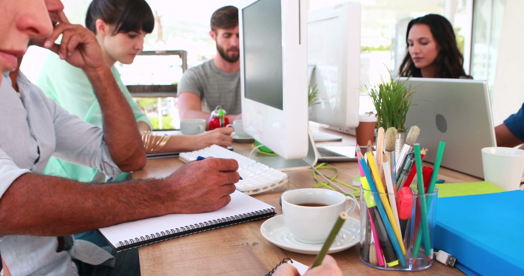Team of Diverse Professionals Collaborating in Modern Office