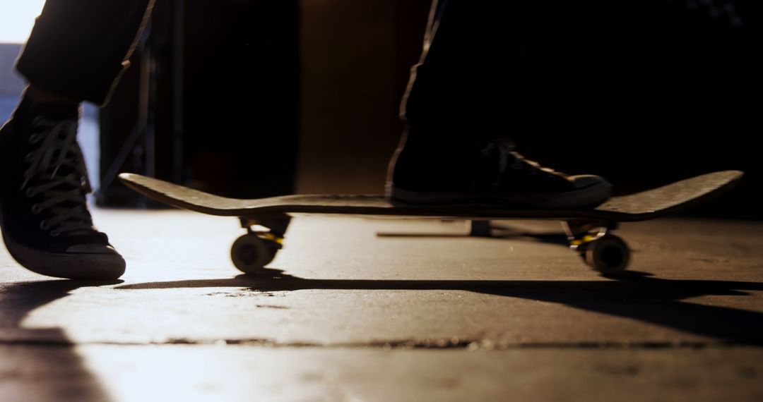 Silhouette of Skateboarder Balancing on Skateboard - Free Images, Stock Photos and Pictures on Pikwizard.com