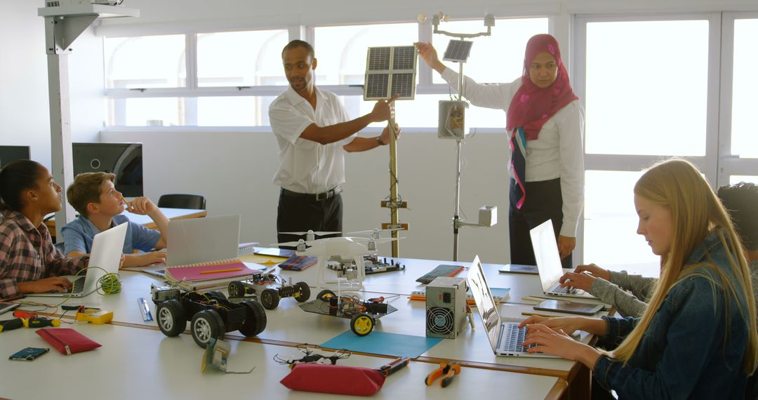 Teacher Demonstrating Solar Panel to Diverse Students in Classroom - Free Images, Stock Photos and Pictures on Pikwizard.com