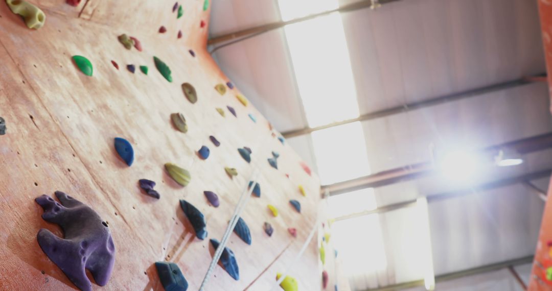 Indoor Rock Climbing Wall with Colorful Handholds - Free Images, Stock Photos and Pictures on Pikwizard.com