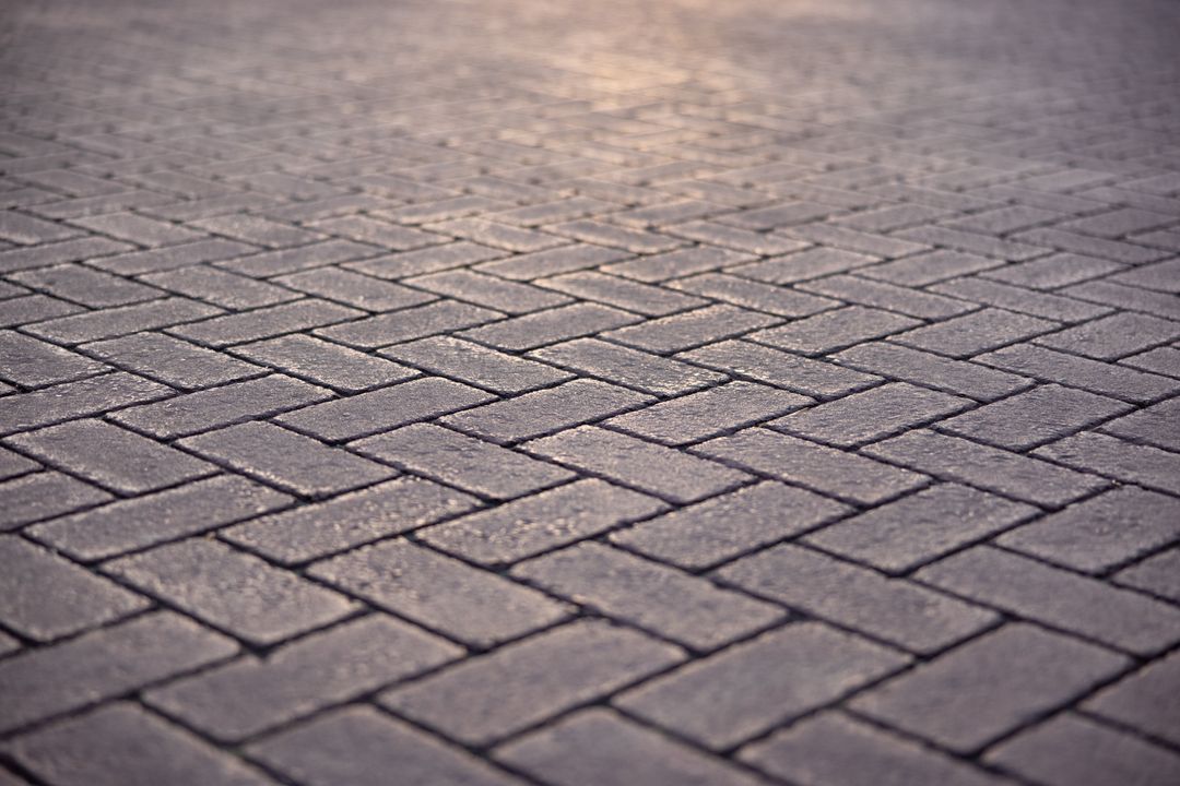 Close-up of Herringbone Pattern Paving Stone Surface