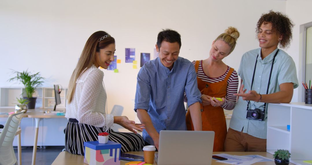 Diverse Team Collaborating Cheerfully in Modern Office