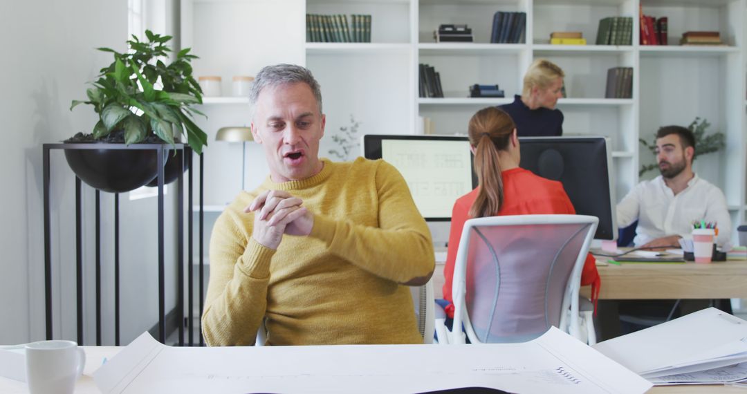 Business Team Discussing Plans in Modern Office Setting