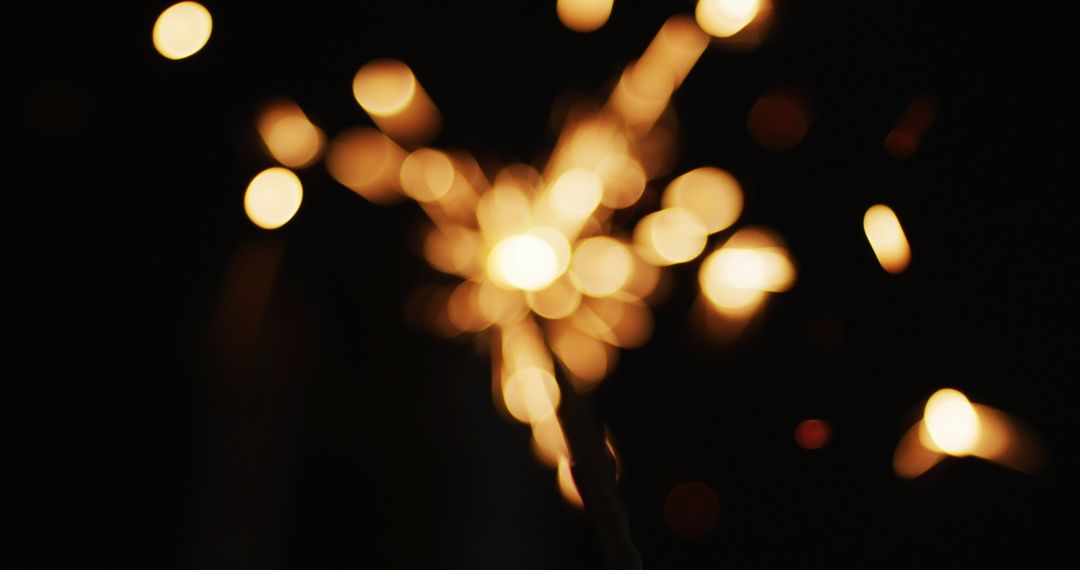 Festive Sparkler Glow on Dark Background