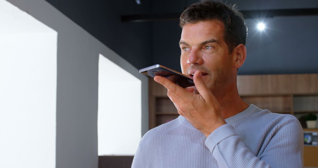 Casual Businessman Talking on Smartphone in Office