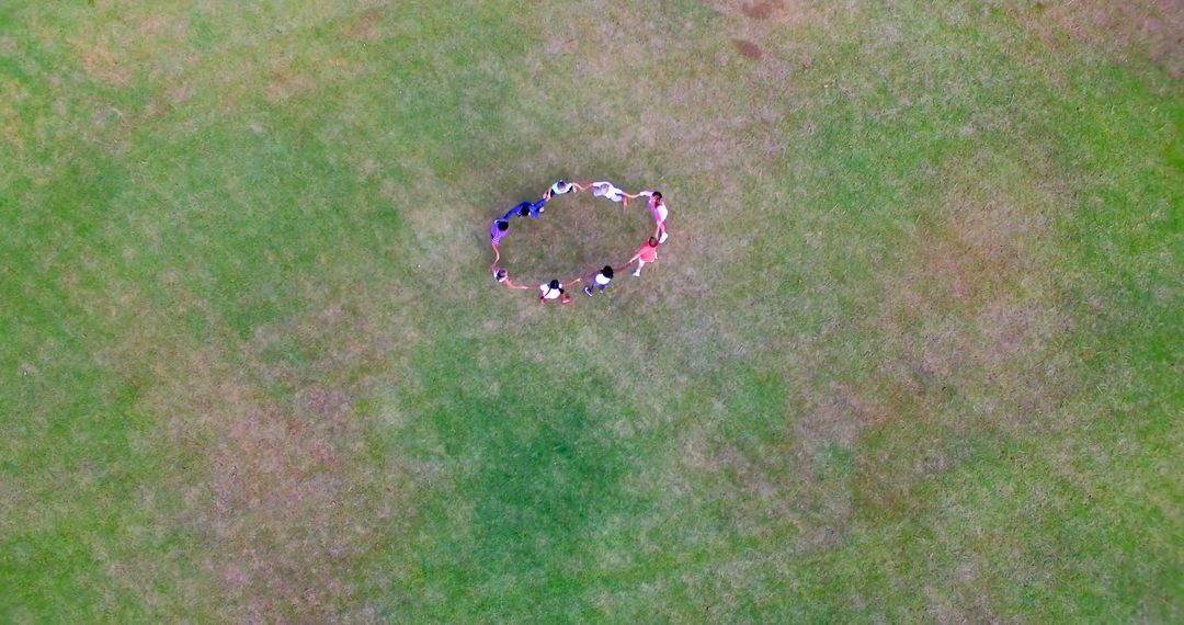 Group of Children Holding Hands in Circular Formation on Grass - Free Images, Stock Photos and Pictures on Pikwizard.com