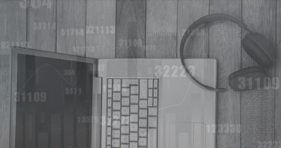 Top View of Laptop and Headphones with Data Overlay