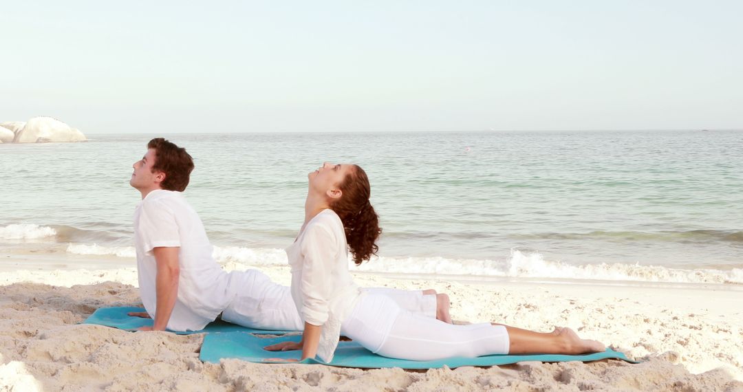 Couple Practicing Yoga Together on Beach - Free Images, Stock Photos and Pictures on Pikwizard.com