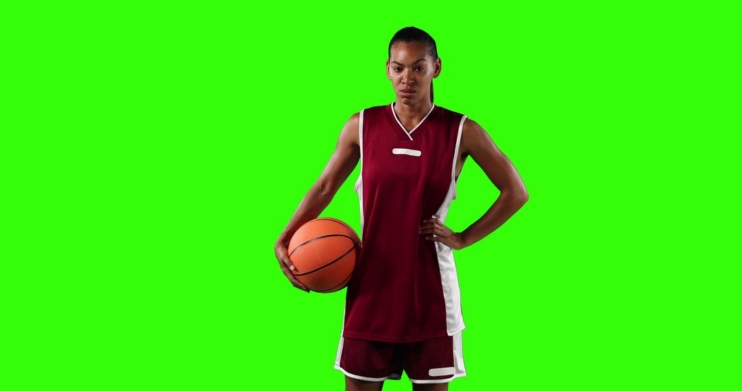 Female Basketball Player Posing Confidently on Green Background - Free Images, Stock Photos and Pictures on Pikwizard.com