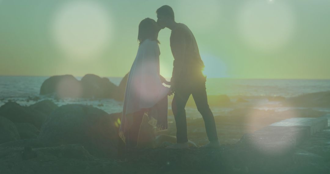 Romantic Couple Sunset Silhouette with Dreamy Light Bokeh