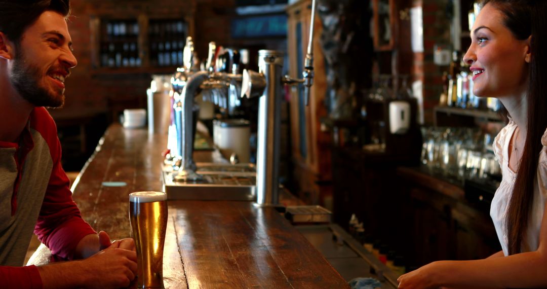 Barmaid Conversing with Customer Over Drink in Cozy Pub