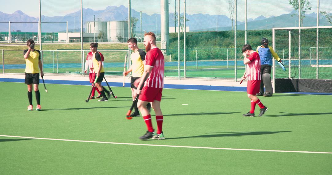 Field Hockey Players Competing on Artificial Turf