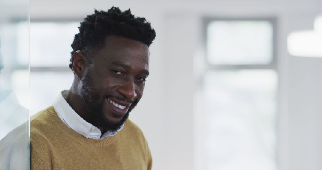 Smiling Businessman in Casual Office Setting
