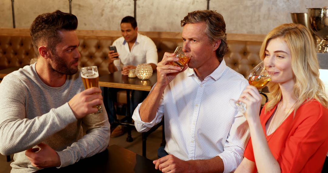 Group of Friends Socializing at Modern Bar