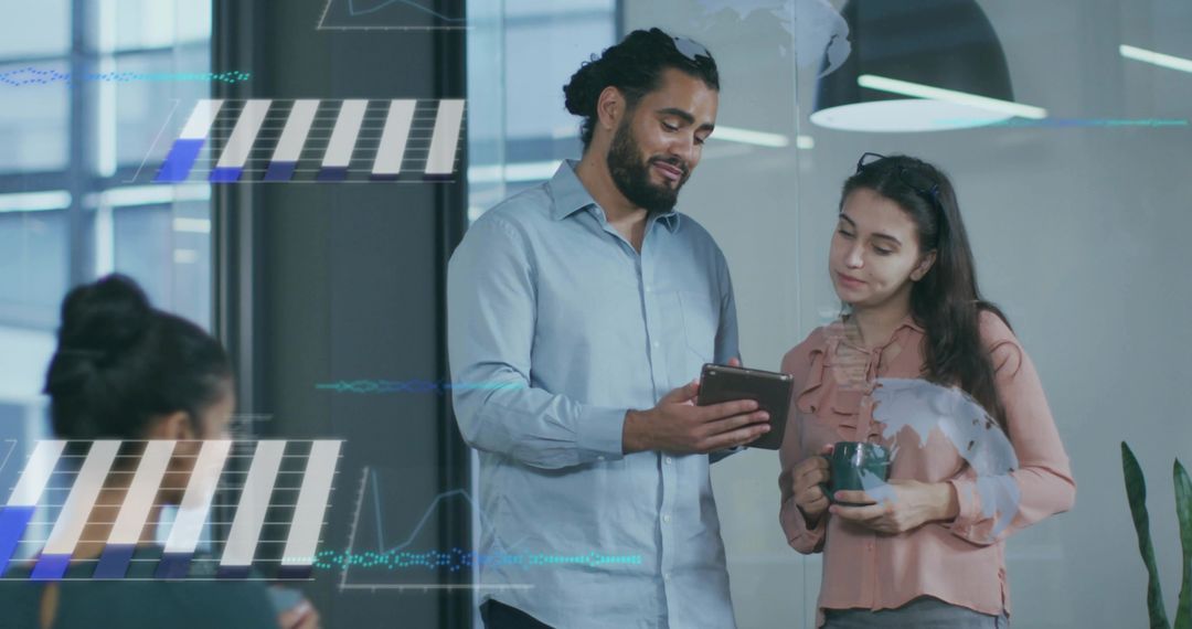 Business Professionals Analyzing Digital Data in Open Office Space