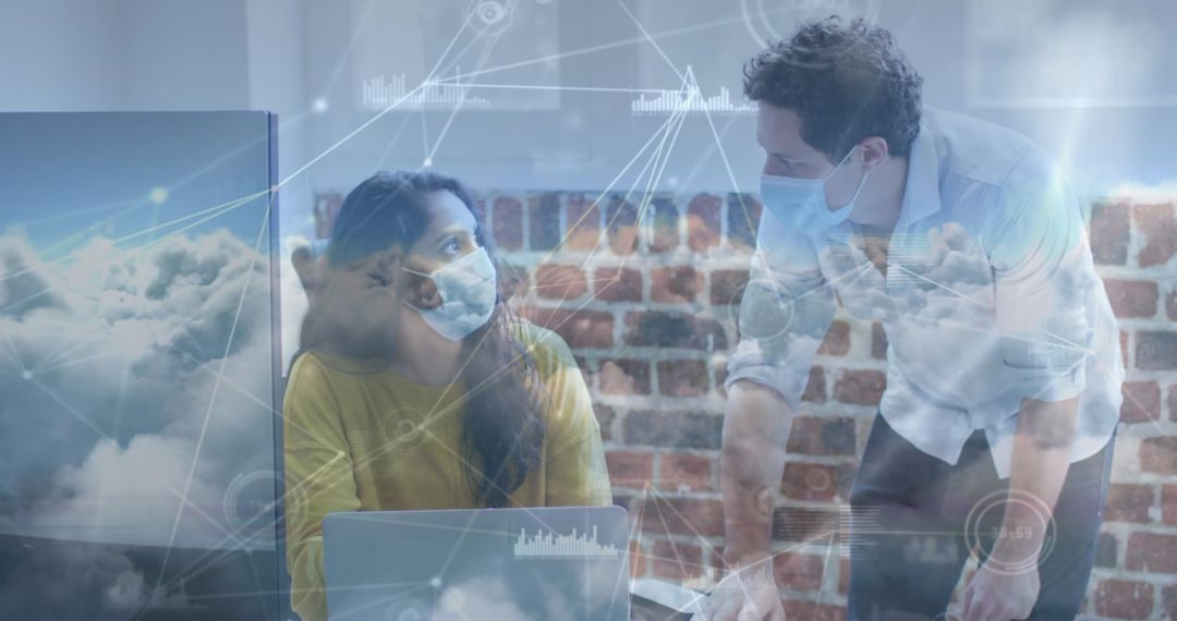 Colleagues in Masks Collaborating in Tech-Driven Workspace