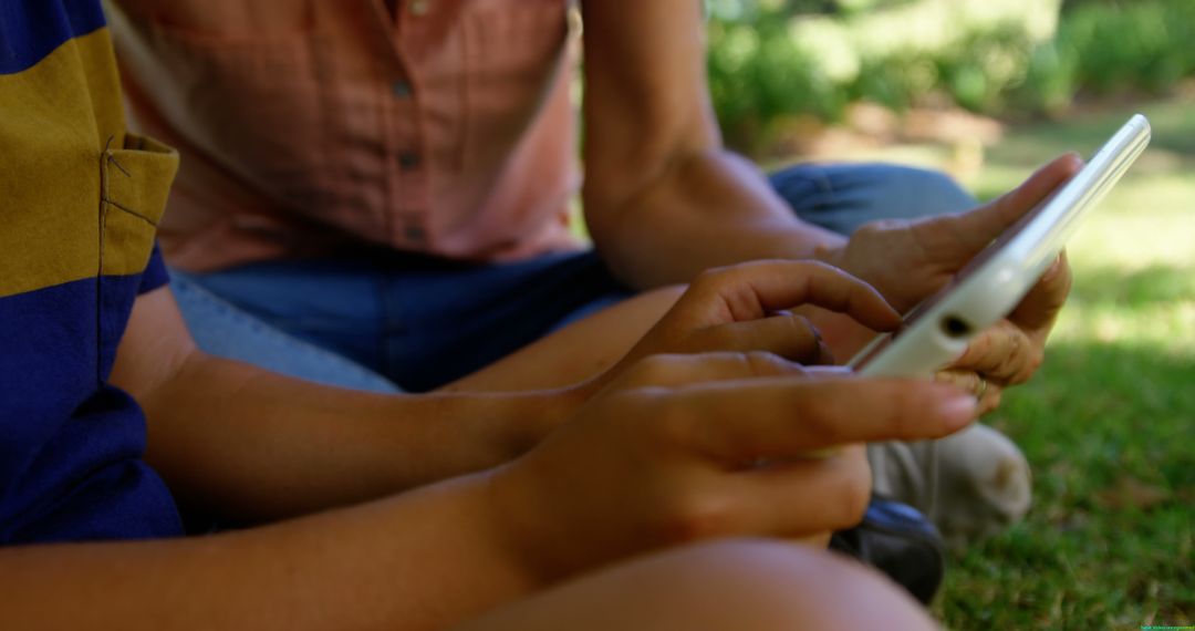 Hands Typing on Tablet in Outdoor Garden Setting - Free Images, Stock Photos and Pictures on Pikwizard.com