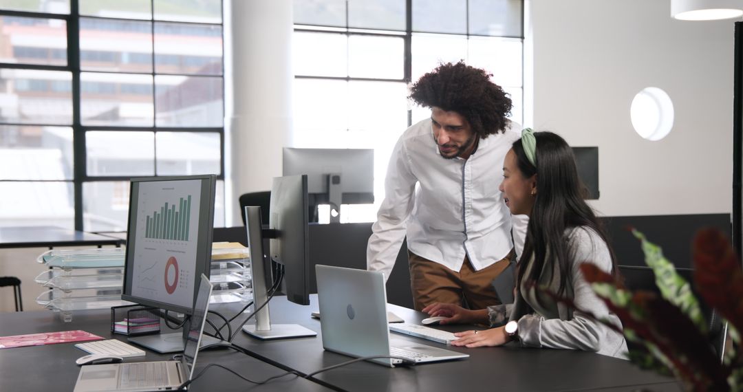 Collaborative Teamwork in Modern Office with Focused Discussion