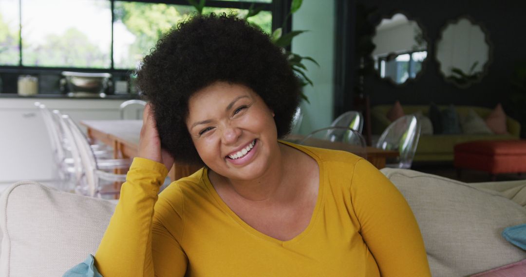 Joyful Plus Size Woman Relaxing at Home Smiling