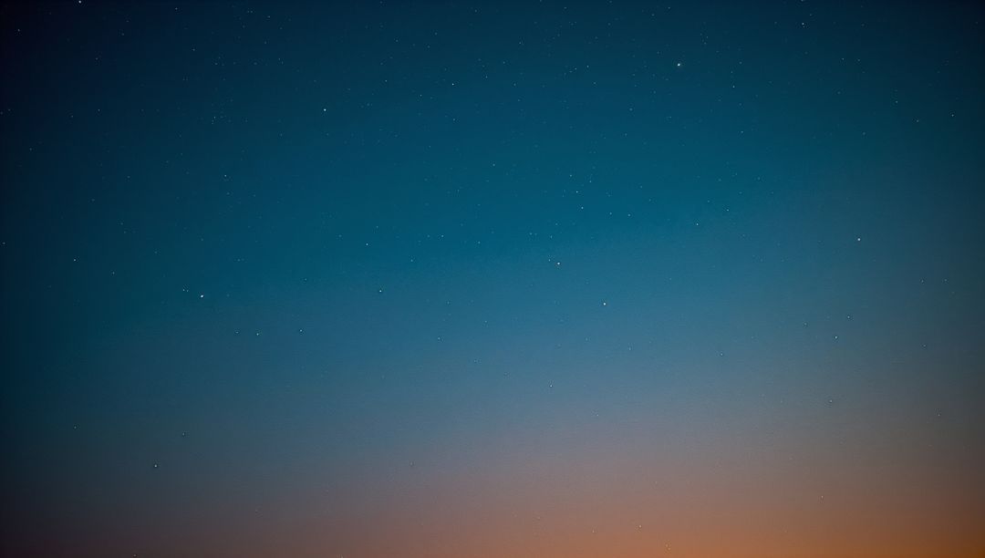 Tranquil Twilight Sky with Soft Stars Over Dusk Horizon