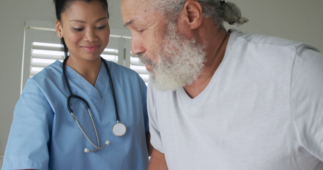 Nurse Assisting Elderly Man with Mobility - Free Images, Stock Photos and Pictures on Pikwizard.com