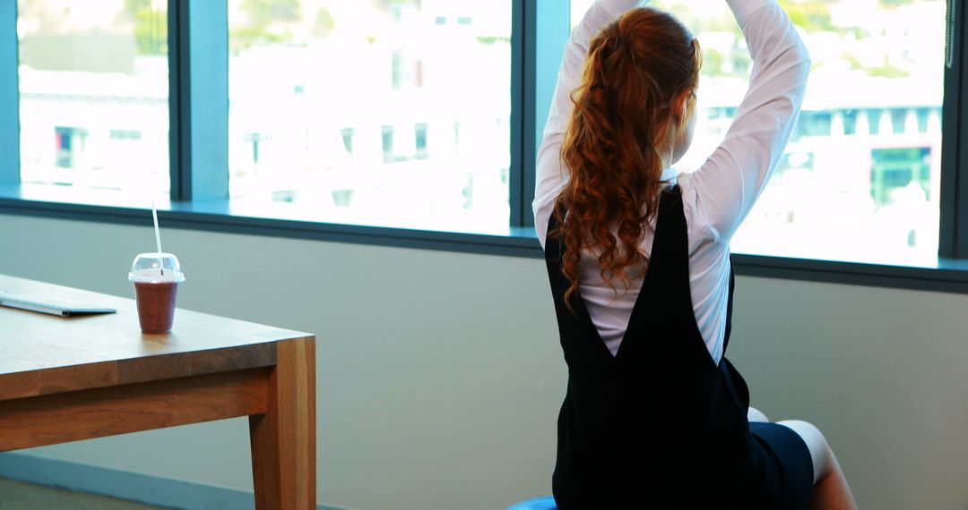 Woman Stretching at Desk in Office for Quick Break - Free Images, Stock Photos and Pictures on Pikwizard.com