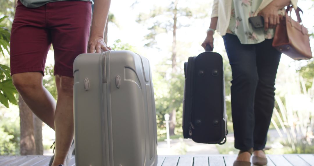 Travelers Carrying Suitcases Outdoors - Free Images, Stock Photos and Pictures on Pikwizard.com