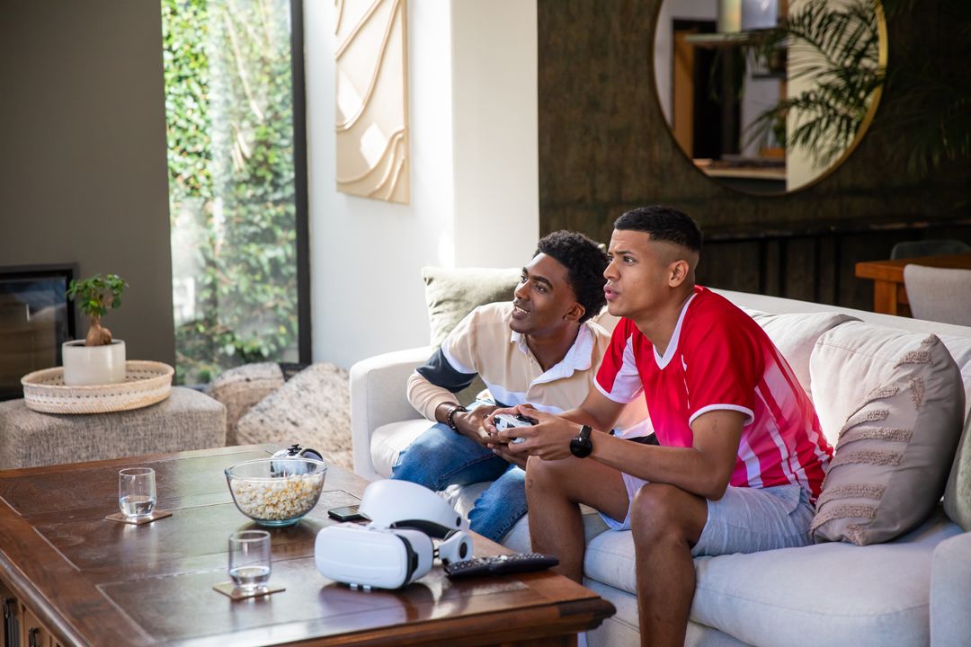 Diverse Friends Gaming Enjoying Relaxing Modern Technology Indoors