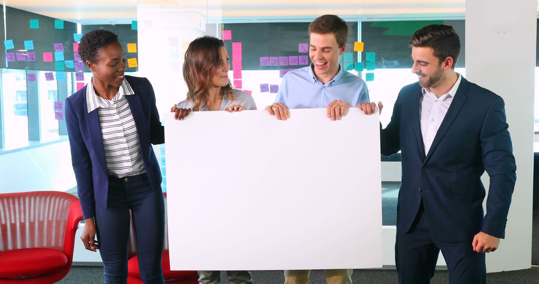 Team Holding Blank Poster During Business Meeting - Free Images, Stock Photos and Pictures on Pikwizard.com