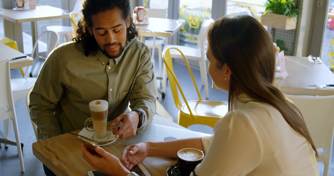 Diverse Friends Connecting Over Coffee in Modern Cafe