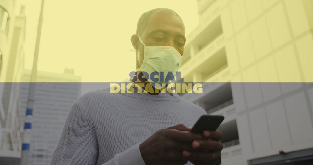 Man in Mask Using Smartphone with Social Distancing Text Overlay