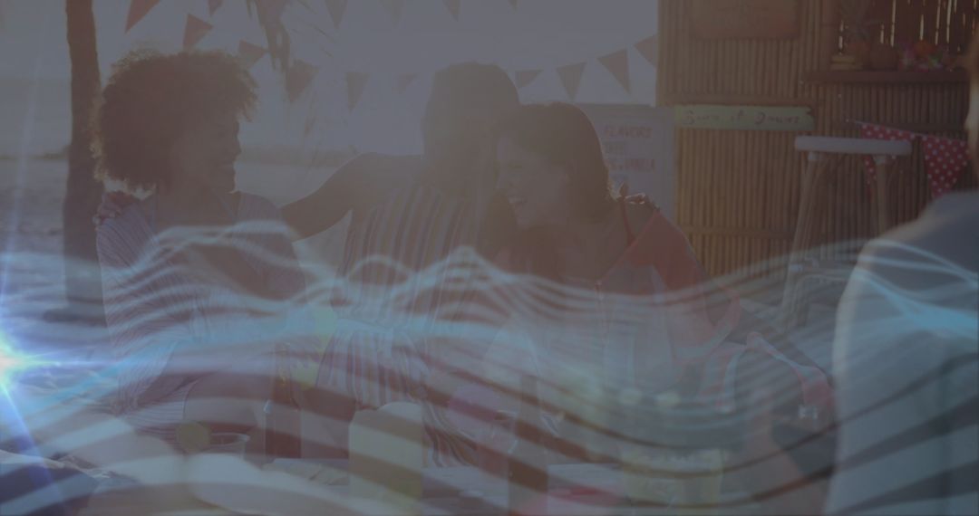 Friends enjoying tropical beach hut picnic with ocean view