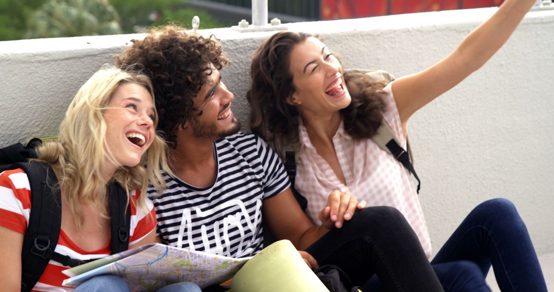 A diverse group of young adults is laughing and taking a selfie together, with copy space - Free Images, Stock Photos and Pictures on Pikwizard.com
