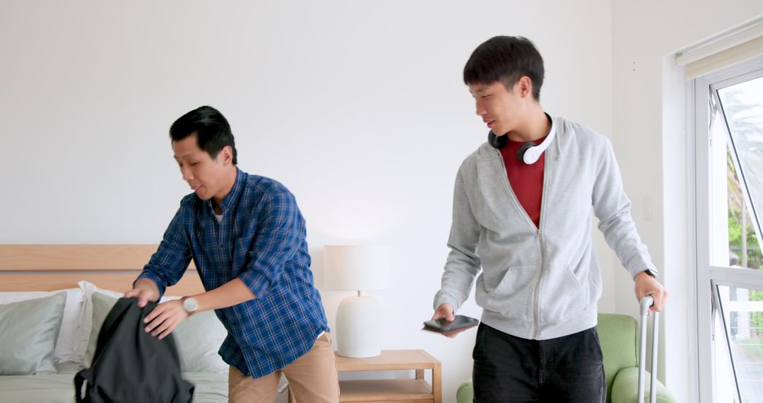 Two Asian Men Interacting in Modern Living Space