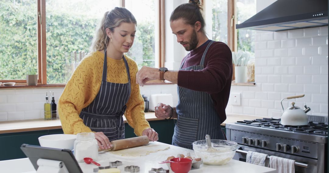 Couple Baking Together in Modern Kitchen with Natural Light - Free Images, Stock Photos and Pictures on Pikwizard.com