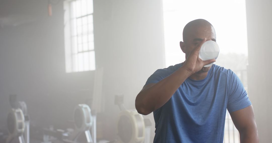 Man Drinking Water in Gym After Workout - Free Images, Stock Photos and Pictures on Pikwizard.com