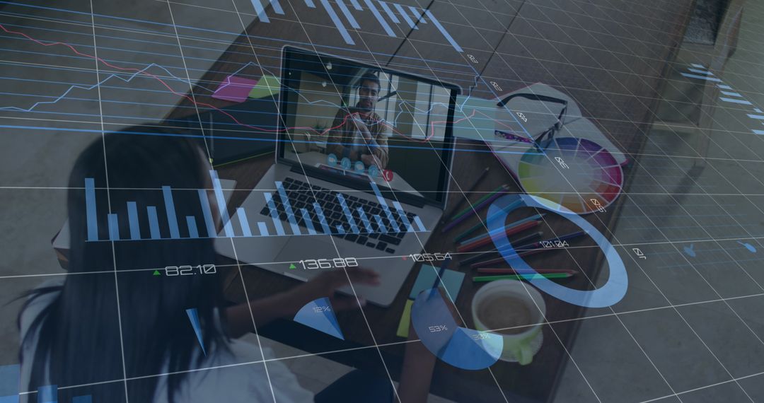 Designer Engaged in Virtual Meeting Amid Financial Analytics Overlay