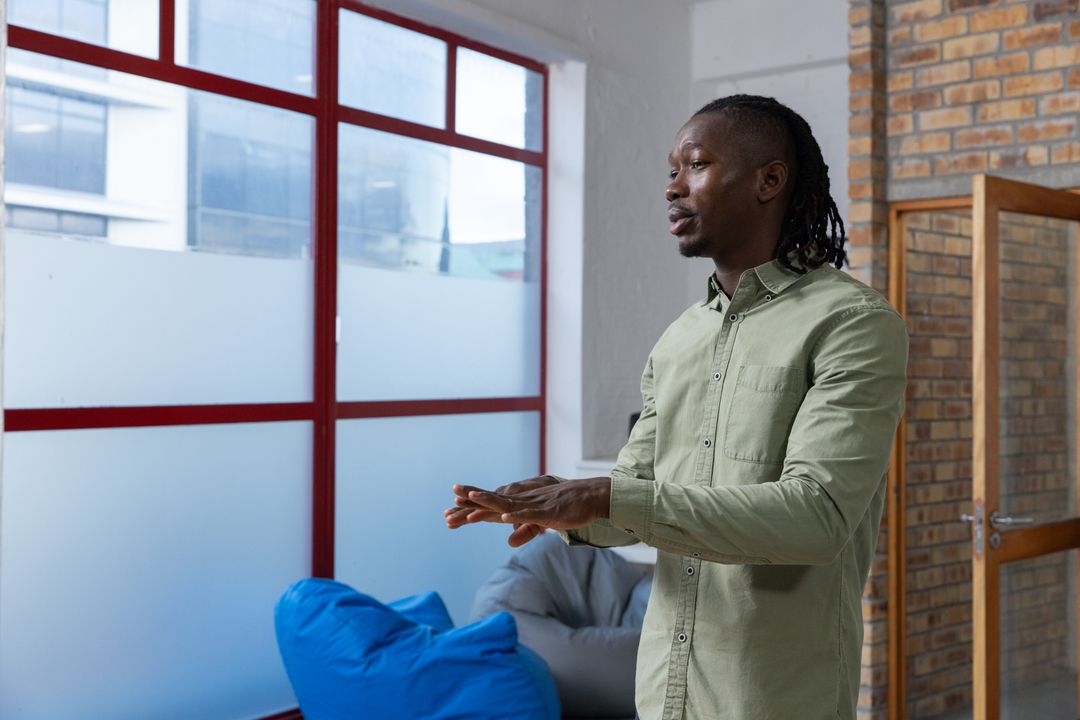 Confident Professional Presenting in Modern Office Space