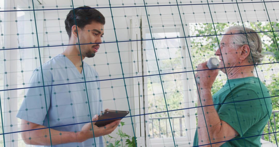 Home health nurse monitoring elderly man taking medication with tablet and digital grid