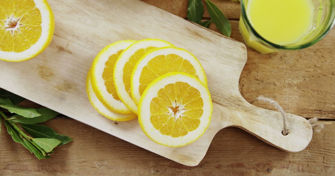 Fresh Lemon Slices on Wooden Cutting Board in Kitchen - Free Images, Stock Photos and Pictures on Pikwizard.com