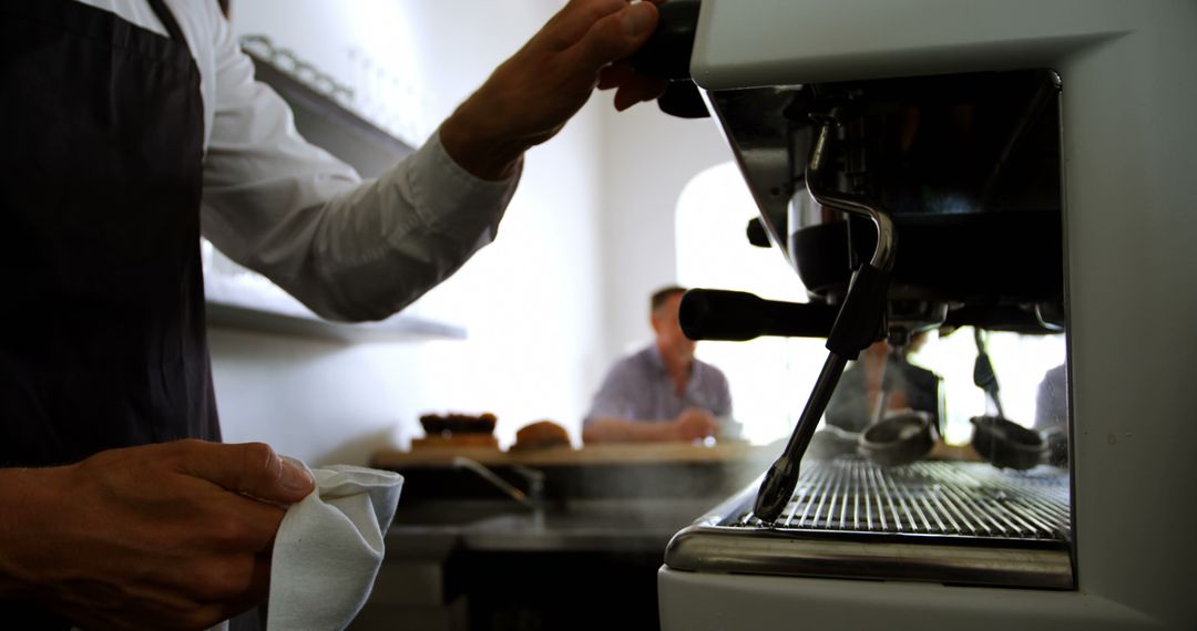 Barista Operating Espresso Machine in Modern Café - Free Images, Stock Photos and Pictures on Pikwizard.com