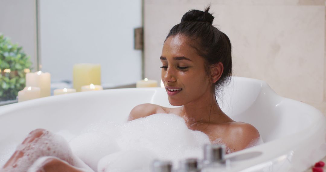 Young Woman Relaxing in Bubble Bath with Candlelight - Free Images, Stock Photos and Pictures on Pikwizard.com