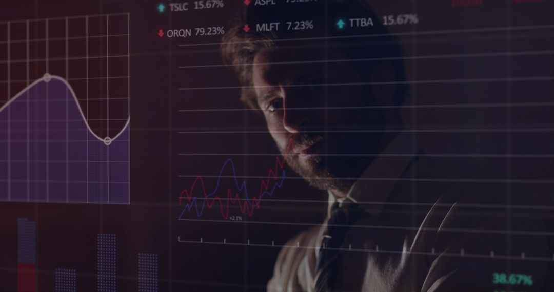 Young Professional Analyzing Financial Graphs on Transparent Screen