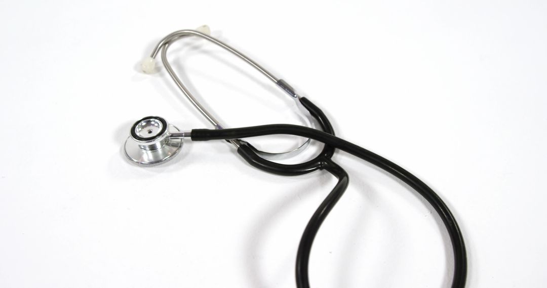 Stethoscope on White Background Symbolizing Health Care and Medicine - Free Images, Stock Photos and Pictures on Pikwizard.com