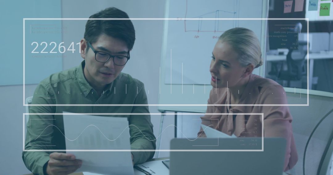 Business Professionals Analyzing Data in Modern Office Meeting