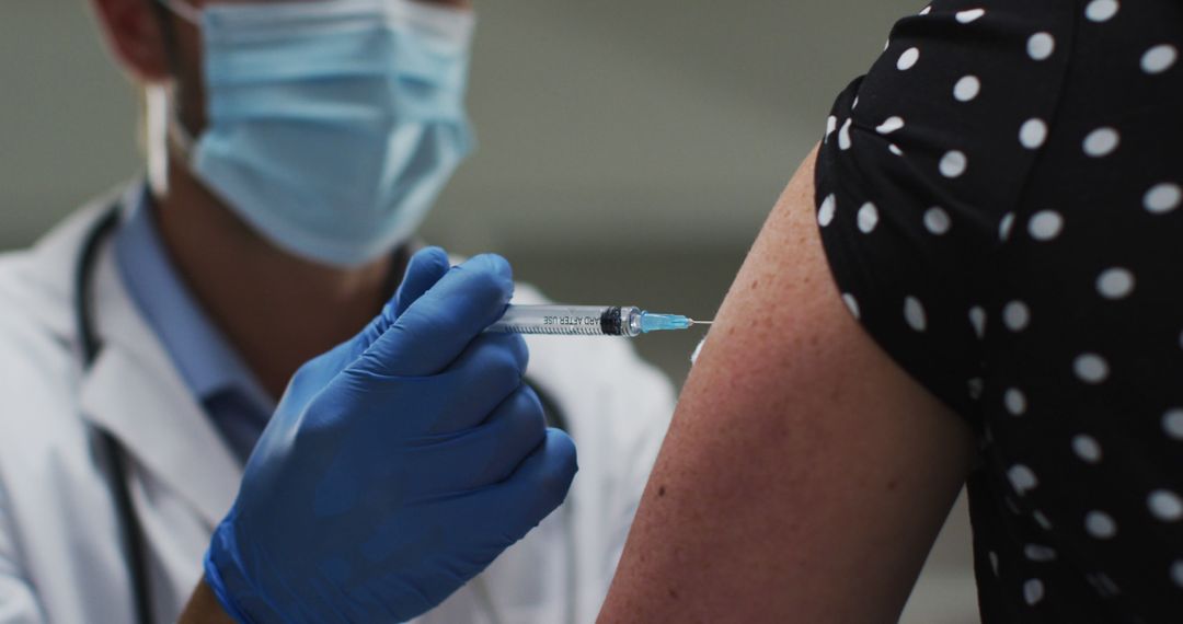 Medical Professional Administering Vaccine to Patient in Clinic - Free Images, Stock Photos and Pictures on Pikwizard.com