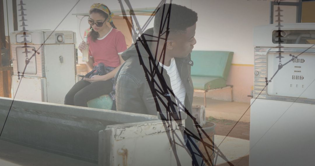 Young Travelers at Retro Gas Station with Tech Overlays